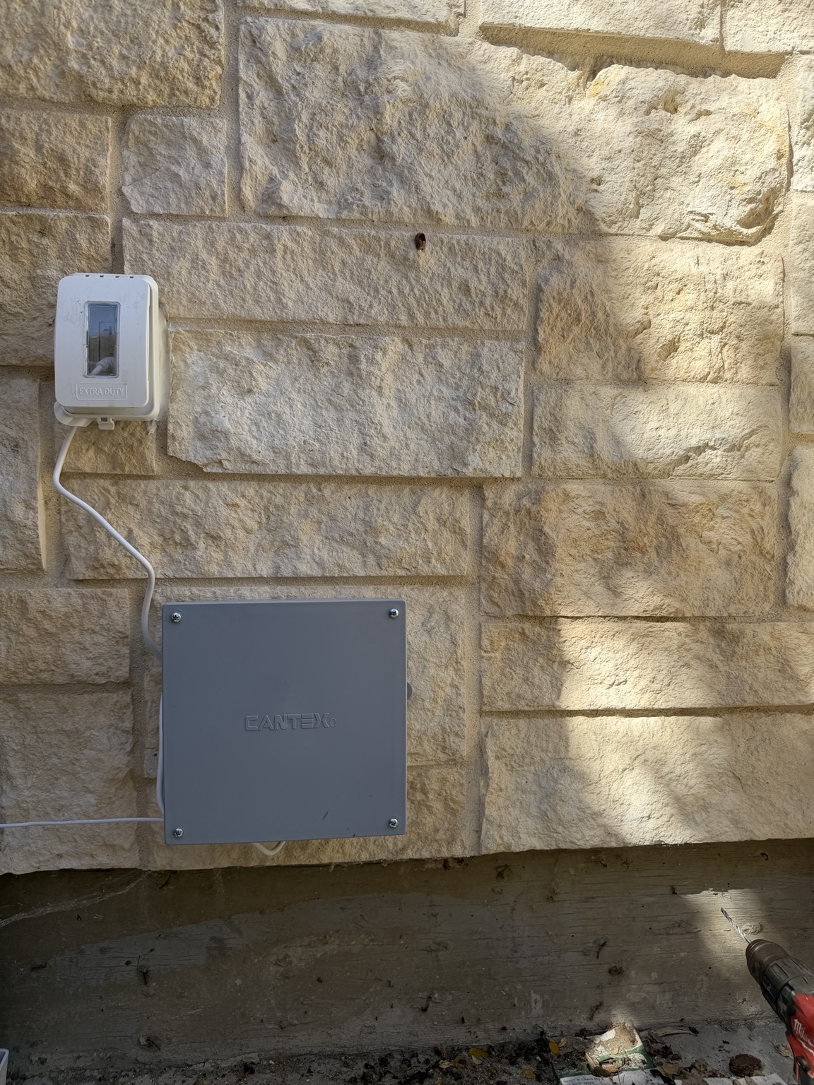 Close-up of concealed wiring at a clean roofline corner transition